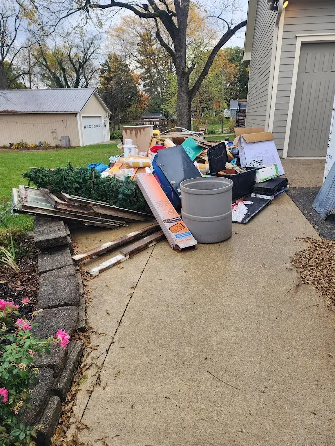 Dumpster being loaded with debris for 3 Yard Dumpster Rental in Prairieville